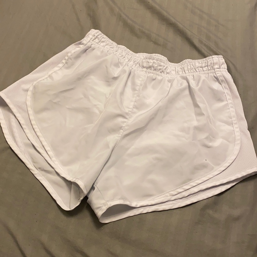 White Nike running shorts